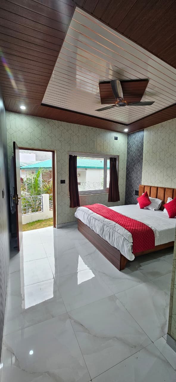 Couple-friendly bedroom with balcony access and mountain view