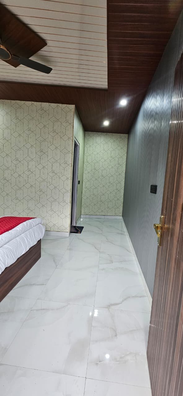 Interior corridor with marble flooring and wood ceiling