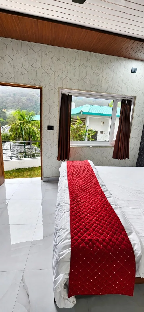 Cozy room with a window to the hills