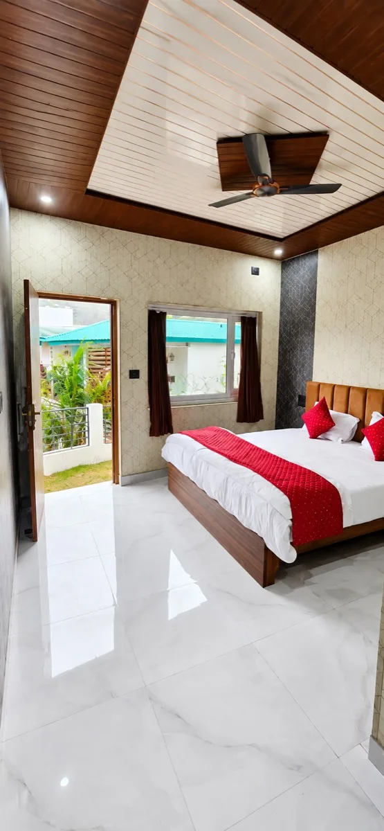 Spacious family room with balcony access and mountain view