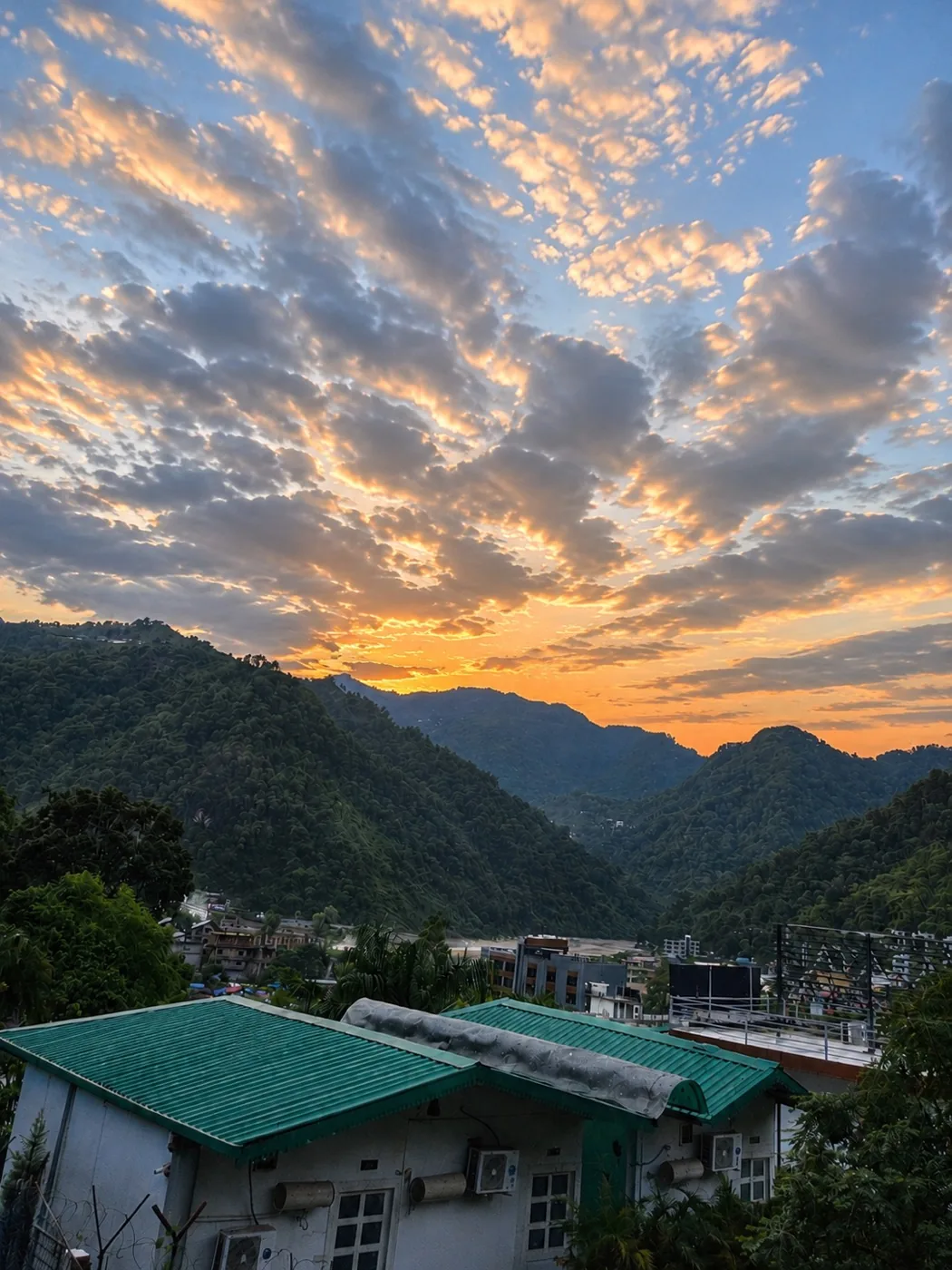 Golden sunset over the ashram and the Rishikesh valley